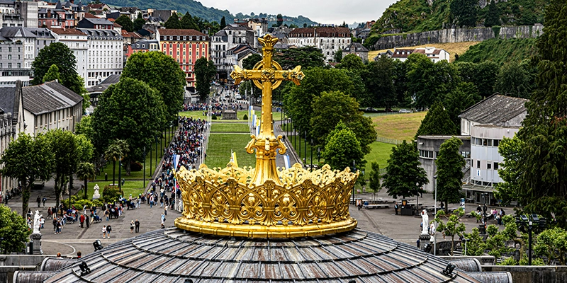 Golden cross at the Sanctuary of Our Lady of Lourdes