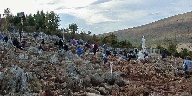 Pilgrims ascend Apparition Hill