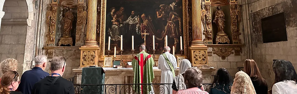 Catholic priest celebrating Mass during a Tekton Ministries pilgrimage in France