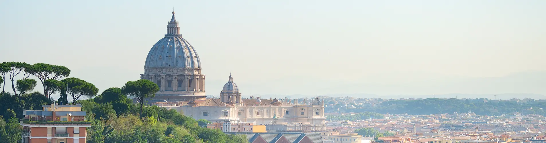 Rome skyline with St. Peter's Basilica dome at golden hour