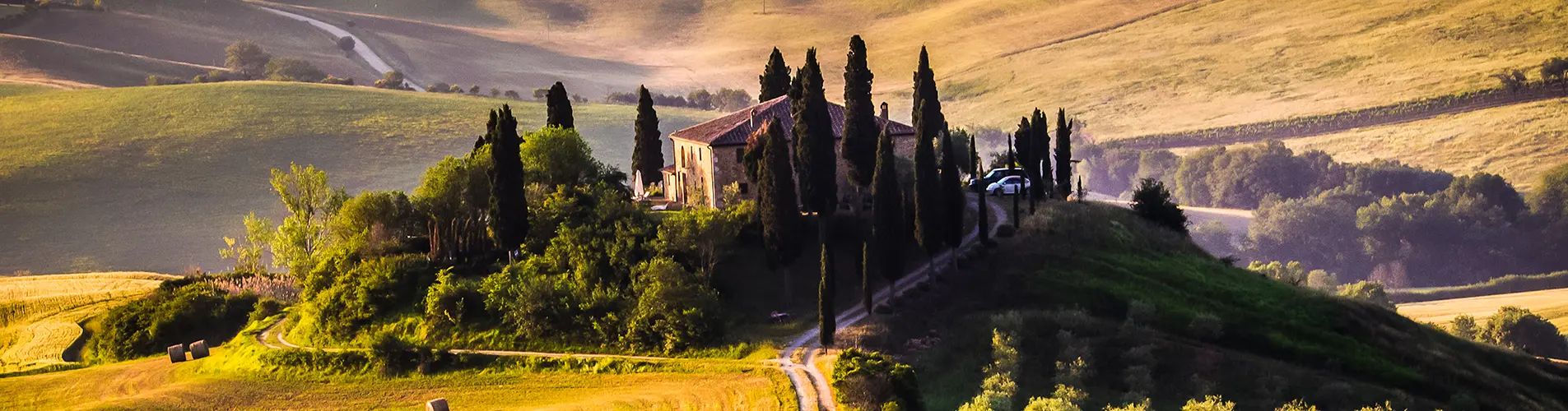 Rolling hills and cypress trees of the Tuscan countryside