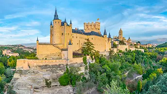 The Alcázar of Segovia at sunset, the medieval Castilian fortress that inspired Walt Disney's Cinderella Castle, Spain