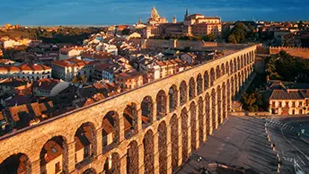 The Roman Aqueduct of Segovia rising 94 feet above the Plaza del Azoguejo, built in the 1st century without mortar
