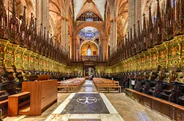 Gothic interior of the Cathedral of Barcelona looking back across the nave from the high altar, dedicated to Saint Eulalia