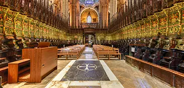 Gothic interior of the Cathedral of Barcelona looking back across the nave from the high altar, dedicated to Saint Eulalia