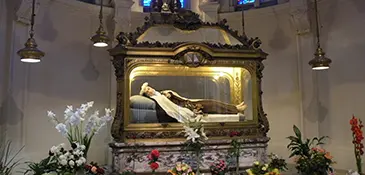 The recumbent effigy of Saint Thérèse of Lisieux containing her relics, displayed in the Carmel chapel where she wrote The Story of a Soul, France