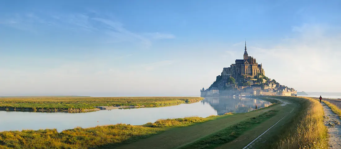 The Benedictine abbey at Mont-Saint-Michel rising from the Normandy tidal flats