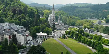 The grass-covered roof of the underground Basilica of Saint Pius X at the Sanctuary of Our Lady of Lourdes