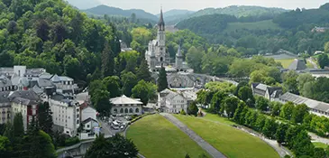 The grass-covered roof of the Basilica of Saint Pius X at Lourdes, one of the world's largest underground churches, seating 25,000 pilgrims