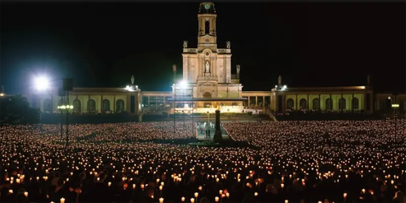 The candlelight procession draws tens of thousands of pilgrims each evening during the major feast days at Fatima.