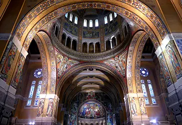 The mosaic-covered nave and central dome of the Basilica of Sainte-Thérèse de Lisieux, the Romano-Byzantine shrine to the Little Flower, France