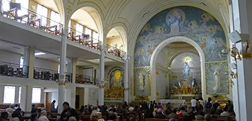 The nave of the Chapel of the Miraculous Medal looking toward the high altar and the statue of Our Lady of the Globe, Rue du Bac, Paris
