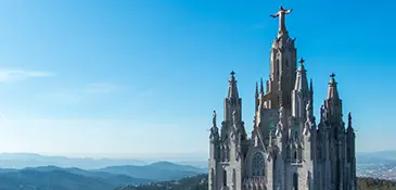 The Temple of the Sacred Heart of Jesus crowned by the bronze Christ statue atop Mount Tibidabo, Barcelona
