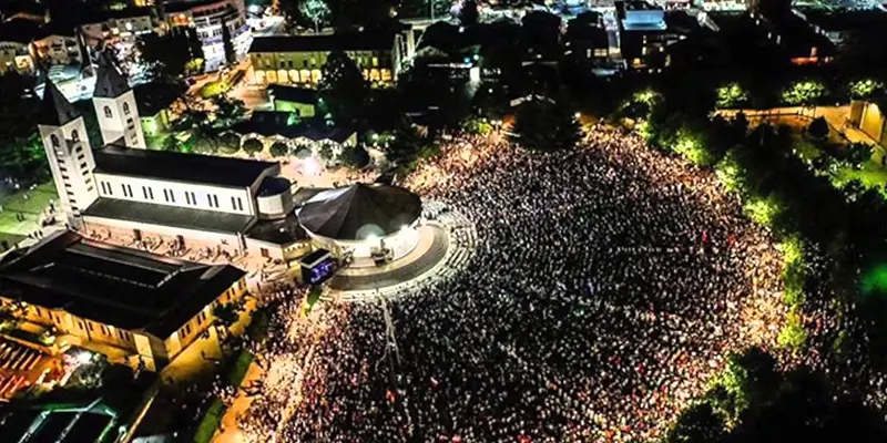 Pilgrims gather outside St. James Church in Medjugorje