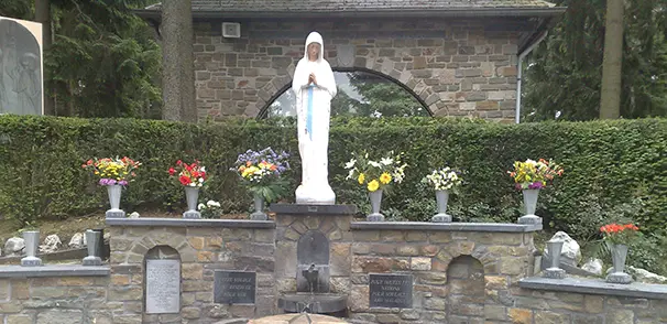 Outdoor statue of Our Lady, the Virgin of the Poor, at the shrine of Banneux, Belgiu