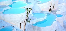 The white travertine terraces of Pamukkale above ancient Hierapolis, Turkey, a UNESCO World Heritage site