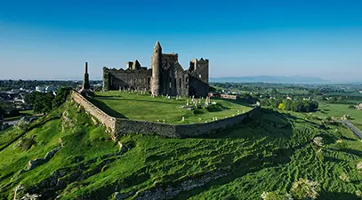 The full Rock of Cashel — its round tower, chapel, and medieval cathedral