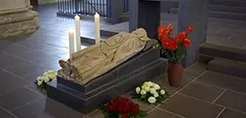 Statue of St. Matthias at the Benedictine abbey holding his tomb in Trier, Germany