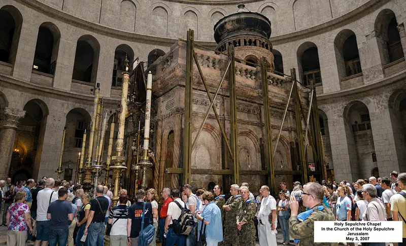 The restored Edicule under the rotunda dome, pilgrims lined up to enter the tomb of Christ.