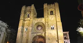 The Sé Cathedral of Lisbon illuminated at night, the city's oldest church, built beginning in 1147 and dedicated to Saint Mary Major
