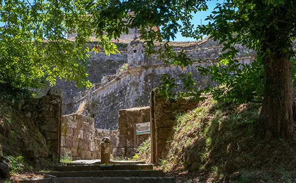 Stone steps rising through a gateway in the fortress walls of Valença do Minho, Portugal — starting point of the Portuguese Camino to Santiago de Compostela