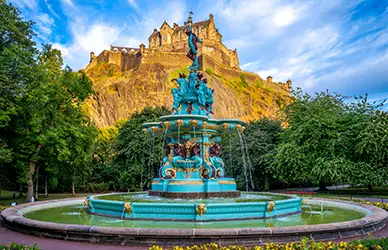 Edinburgh Castle above the Ross Fountain in Princes Street Gardens, Scotland — England and Scotland pilgrimage