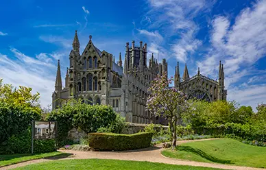 Ely Cathedral rising above its gardens in Cambridgeshire, built over the monastery St. Etheldreda founded in 673