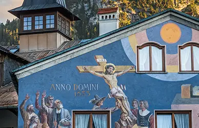 Lüftlmalerei fresco of the Crucifixion on a house façade in Oberammergau, Germany