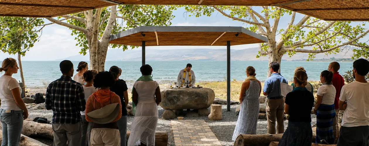 Parish pilgrimage group at an outdoor Mass on the shore of the Sea of Galilee in the Holy Land